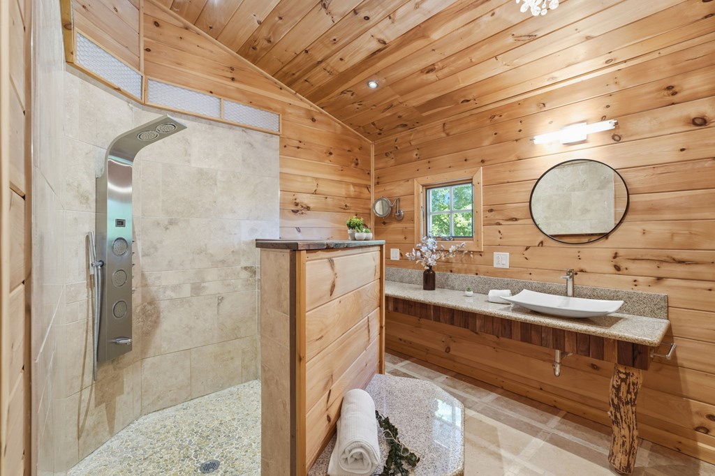 1823 Shoal Creek Road Clarkesville, GA 30523 - Photo 86 of 149 a bathroom with a double vanity sink mirror and shower