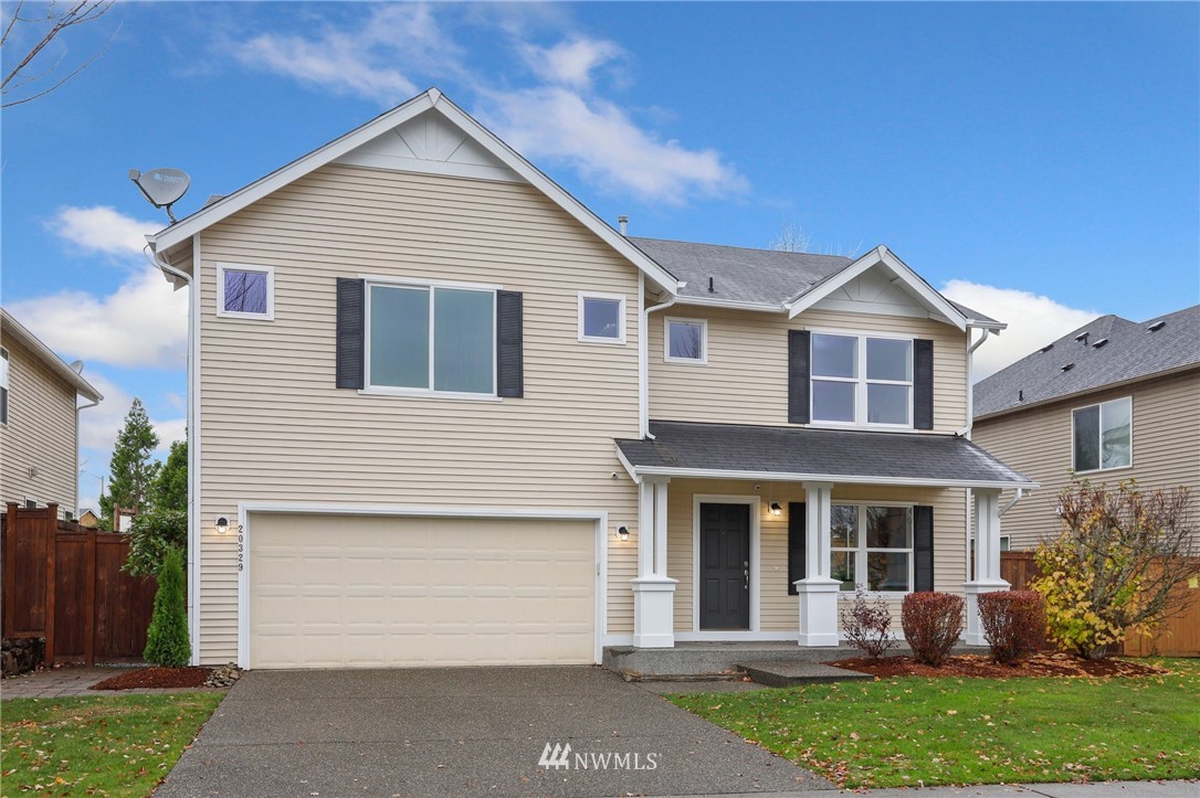 20329 Corbridge Road Southeast Monroe, WA 98272 - Photo 1 of 38 a front view of a house with garden