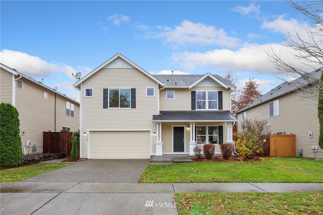20329 Corbridge Road Southeast Monroe, WA 98272 - Photo 3 of 38 a front view of a house with a garden and plants