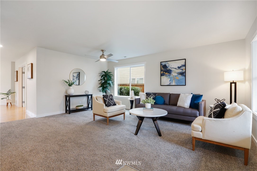 20329 Corbridge Road Southeast Monroe, WA 98272 - Photo 4 of 38 a living room with furniture and a large window