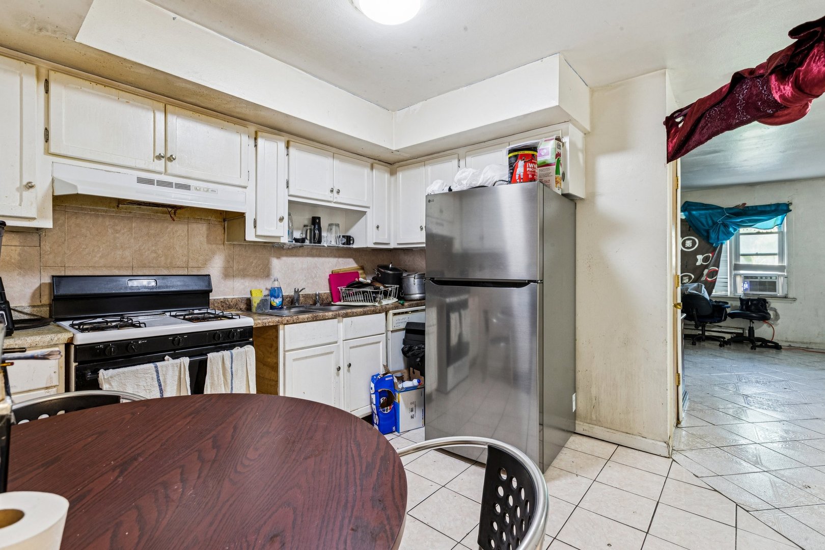 1115 East Algonquin Road, Unit 8 Arlington Heights, IL 60005 - Photo 4 of 11 a kitchen with refrigerator and cabinets