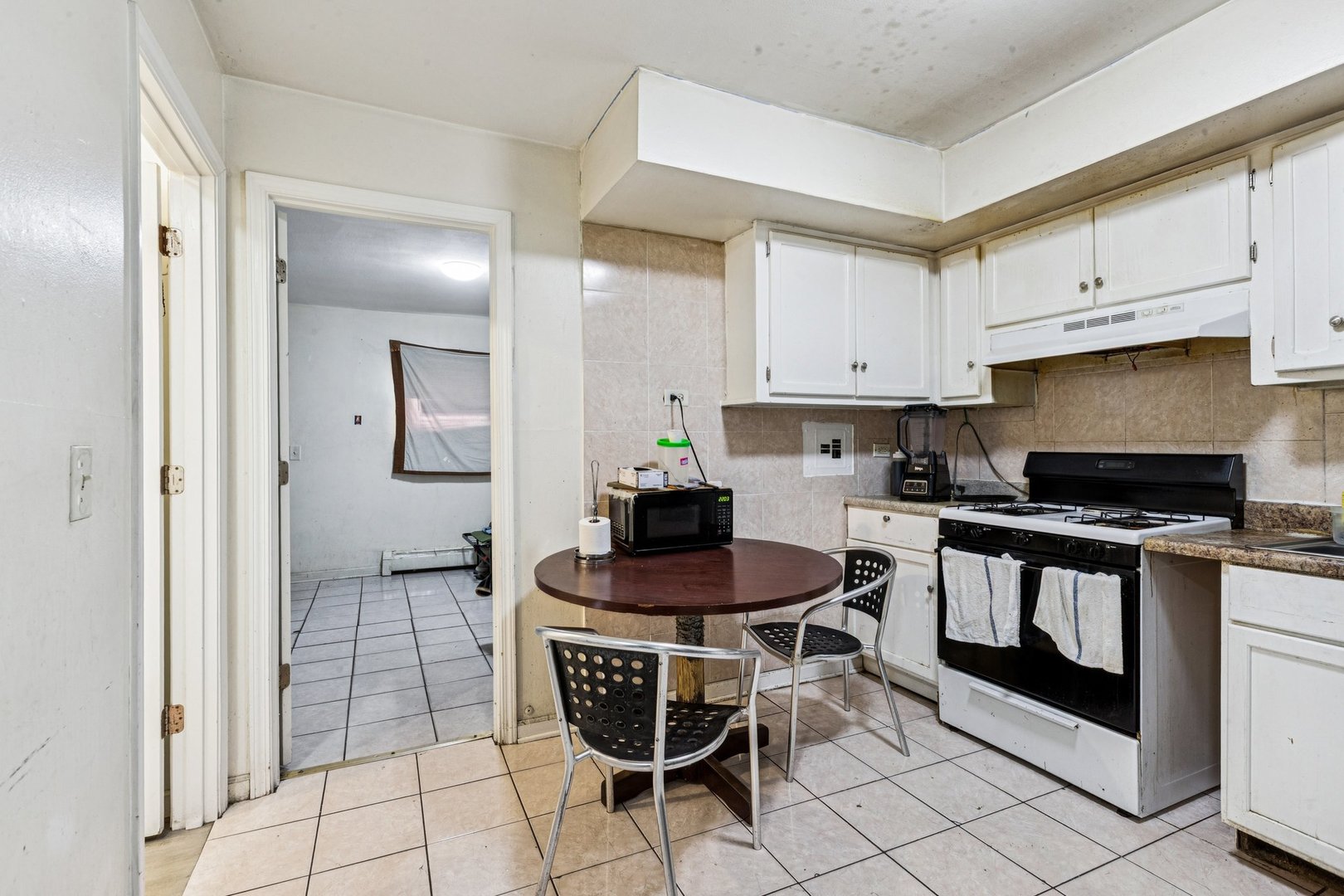 1115 East Algonquin Road, Unit 8 Arlington Heights, IL 60005 - Photo 5 of 11 a kitchen with stainless steel appliances a stove a sink and a refrigerator