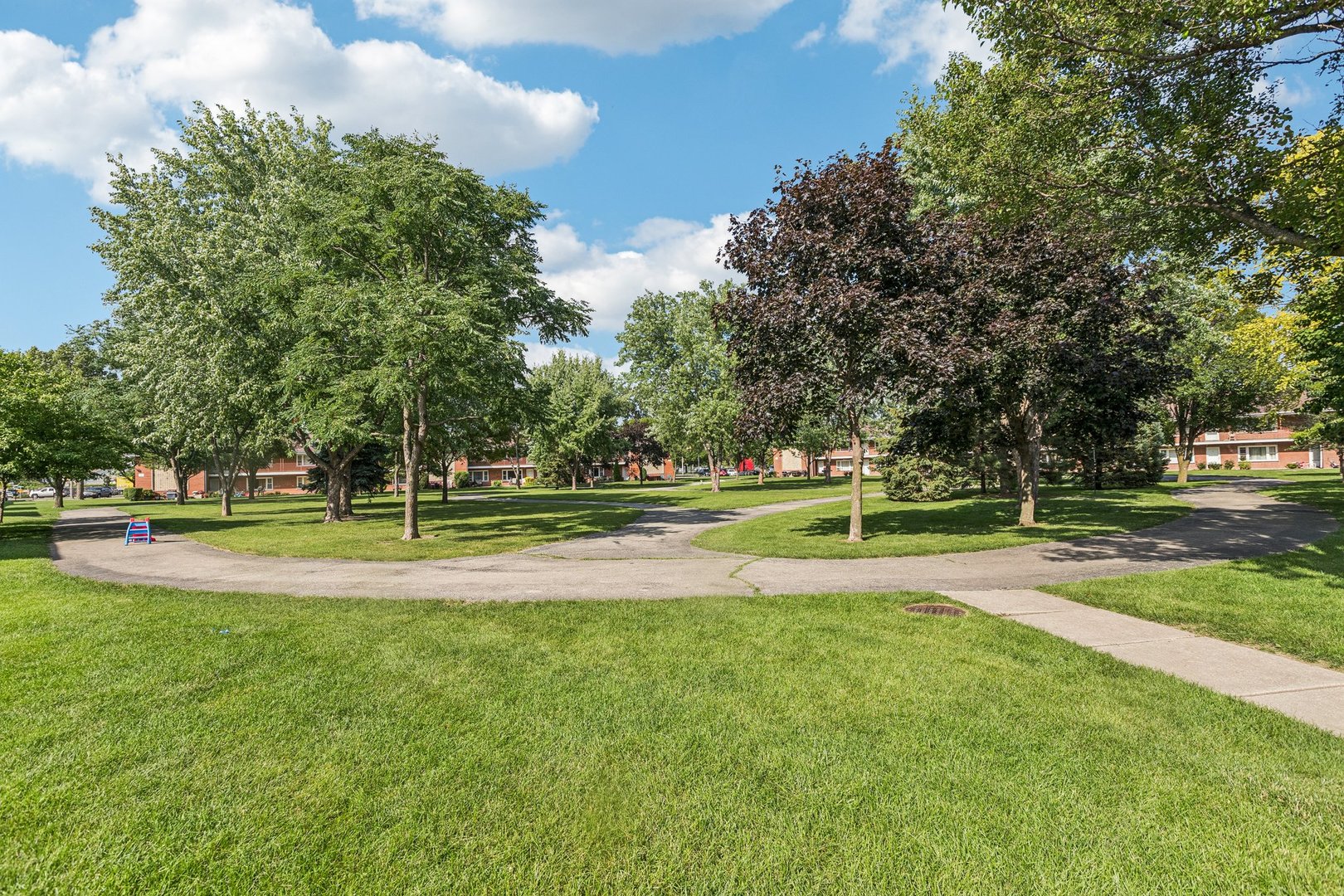 1115 East Algonquin Road, Unit 8 Arlington Heights, IL 60005 - Photo 10 of 11 a view of a swimming pool with a house