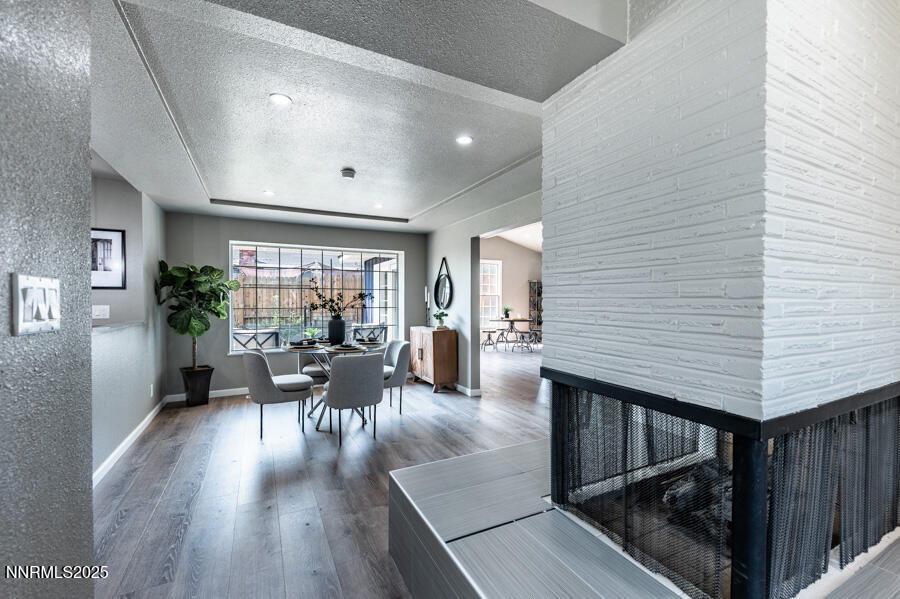 3390 Cashill Boulevard Reno, NV 89509 - Photo 12 of 51 a view of a dining room with furniture window and wooden floor