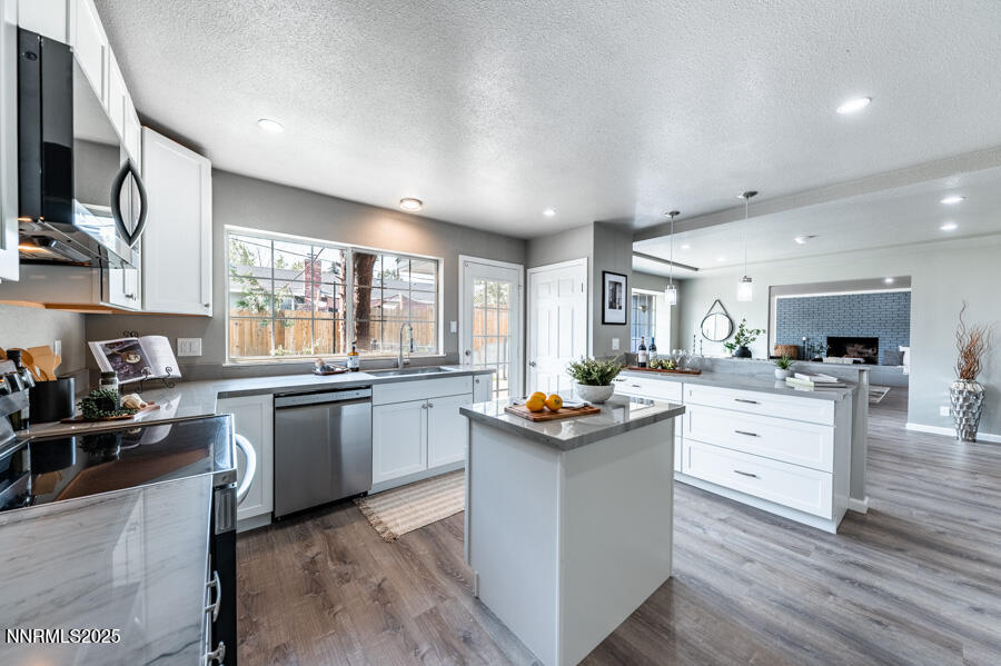 3390 Cashill Boulevard Reno, NV 89509 - Photo 15 of 51 a kitchen with white cabinets and appliances