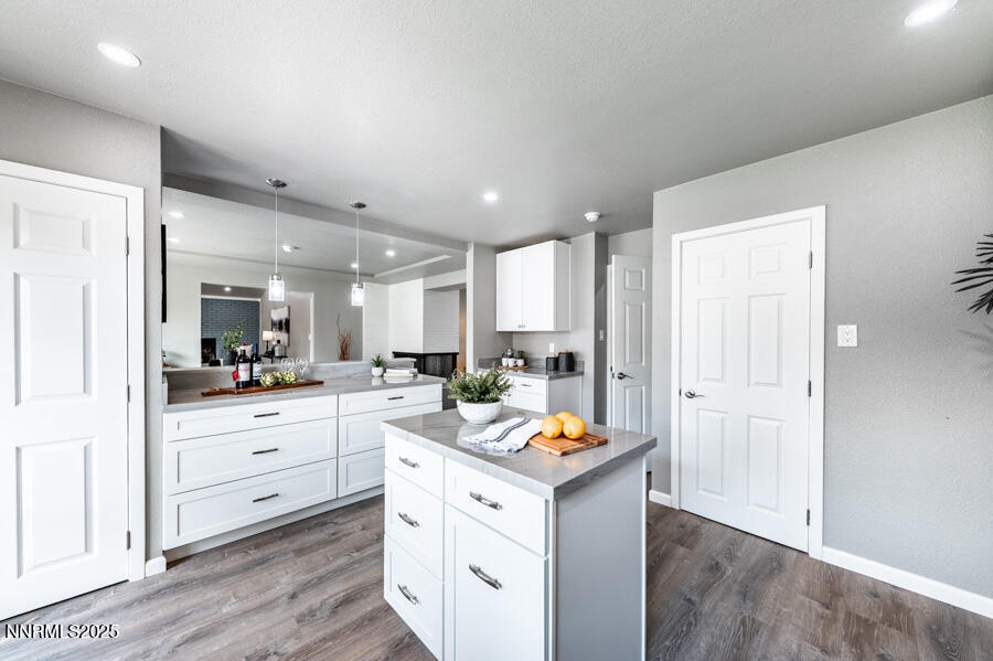 3390 Cashill Boulevard Reno, NV 89509 - Photo 18 of 51 a kitchen with a refrigerator and white cabinets