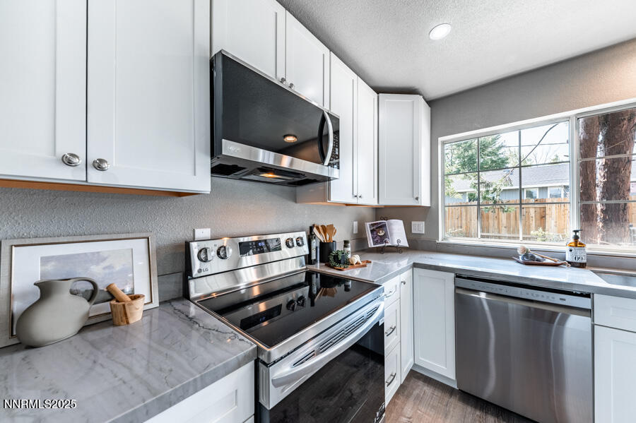 3390 Cashill Boulevard Reno, NV 89509 - Photo 19 of 51 a kitchen with a sink a stove and microwave
