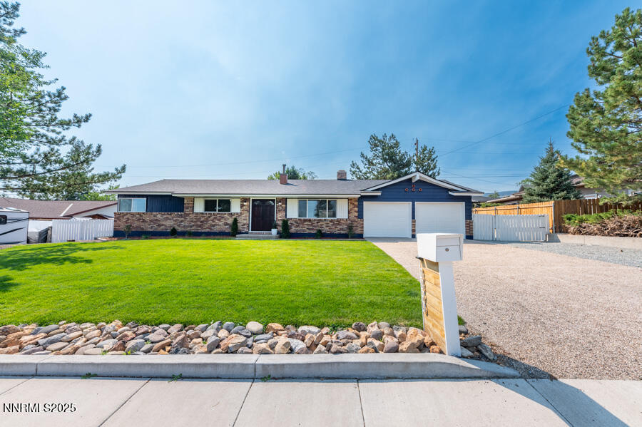 3390 Cashill Boulevard Reno, NV 89509 - Photo 2 of 51 a front view of a house with a yard