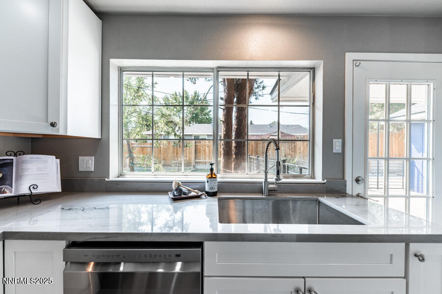 3390 Cashill Boulevard Reno, NV 89509 - Photo 21 of 51 a kitchen with granite countertop a sink and a window