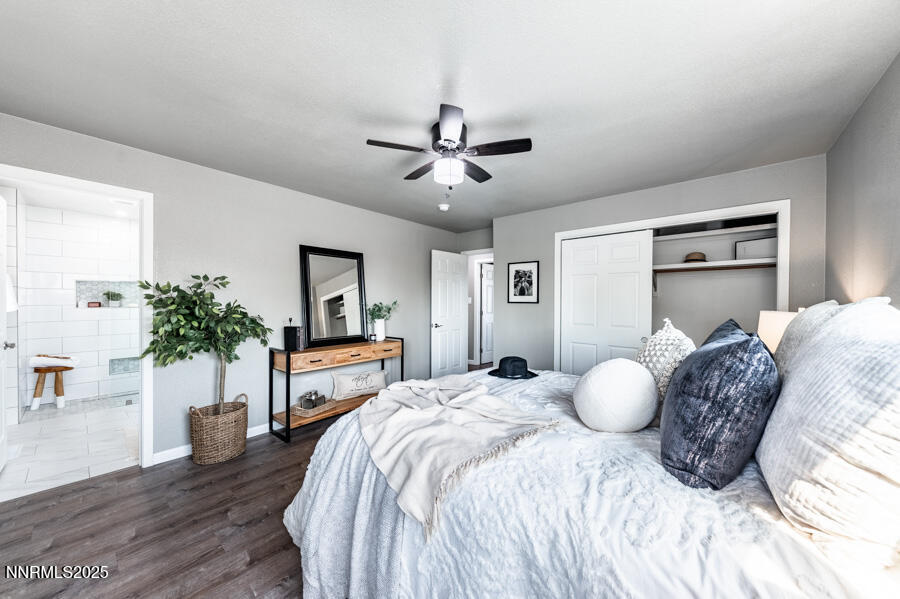 3390 Cashill Boulevard Reno, NV 89509 - Photo 30 of 51 a spacious bedroom with a large bed and a chandelier