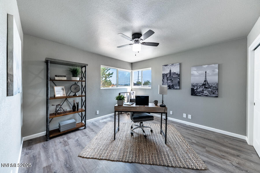 3390 Cashill Boulevard Reno, NV 89509 - Photo 33 of 51 a workspace with furniture window and wooden floor