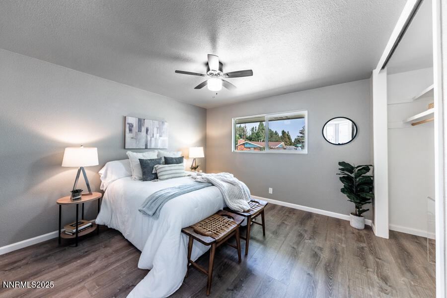 3390 Cashill Boulevard Reno, NV 89509 - Photo 34 of 51 a bedroom with a bed and a chandelier