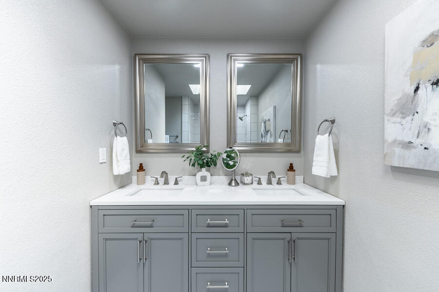 3390 Cashill Boulevard Reno, NV 89509 - Photo 37 of 51 a bathroom with double sink and two mirror