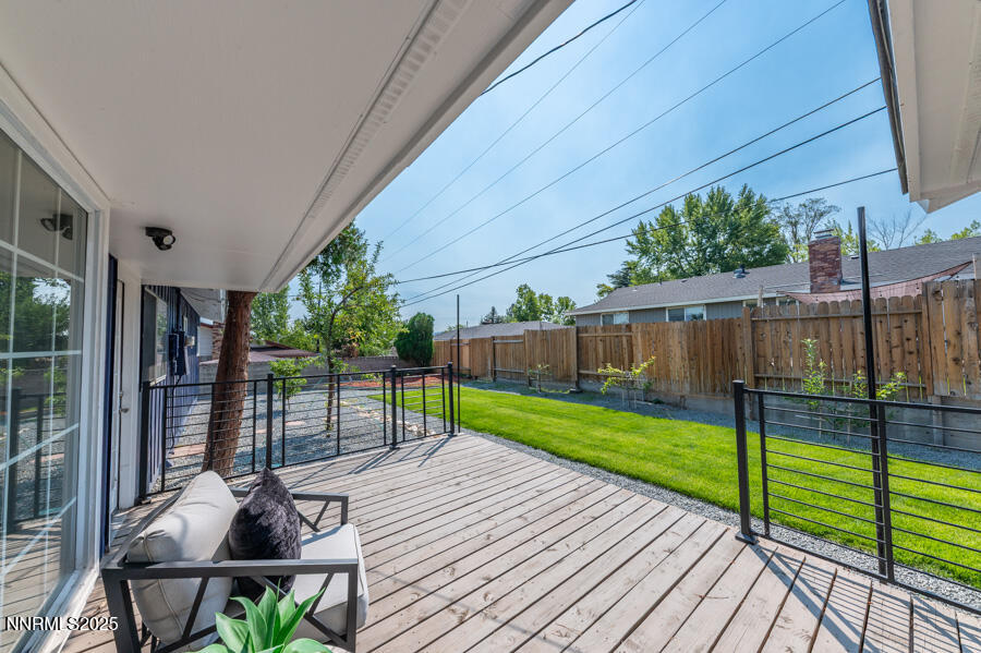 3390 Cashill Boulevard Reno, NV 89509 - Photo 39 of 51 a patio with table and chairs and wooden fence