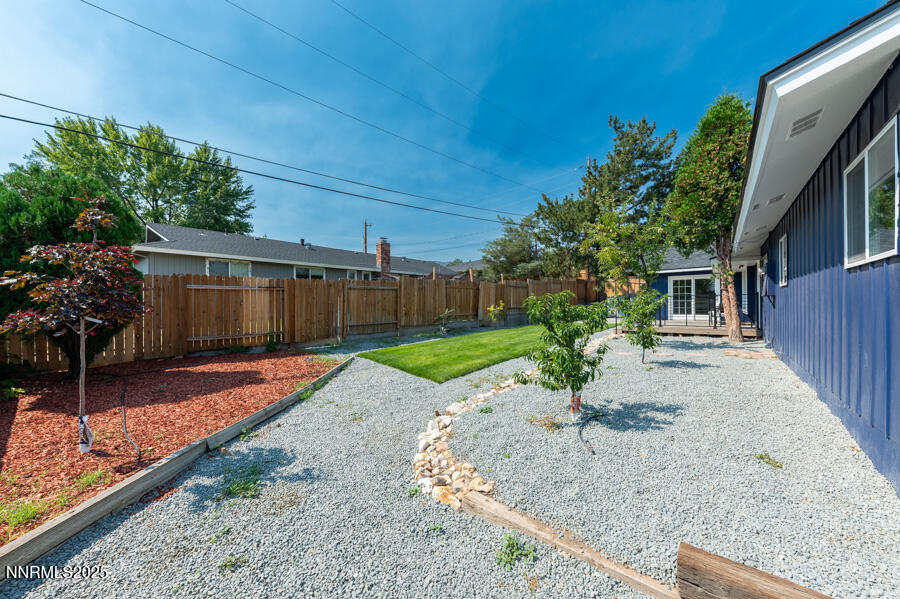 3390 Cashill Boulevard Reno, NV 89509 - Photo 45 of 51 a view of a backyard with potted plants and large tree