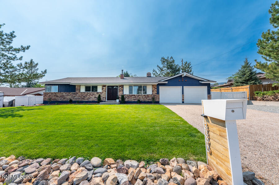 3390 Cashill Boulevard Reno, NV 89509 - Photo 5 of 51 a front view of house with a garden and deck