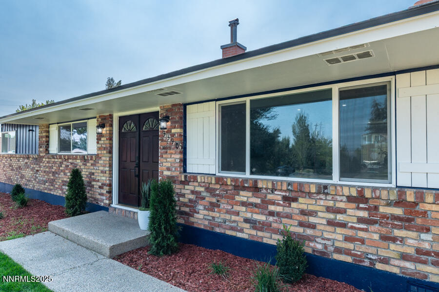 3390 Cashill Boulevard Reno, NV 89509 - Photo 7 of 51 a front view of a house with garden