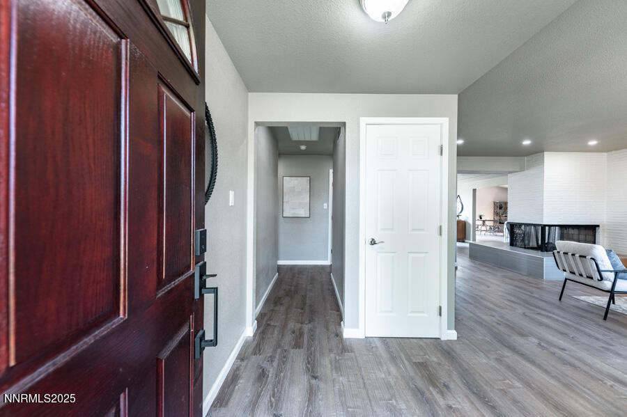 3390 Cashill Boulevard Reno, NV 89509 - Photo 8 of 51 a view of a hallway with wooden floor