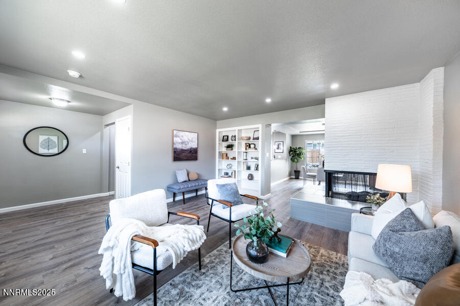 3390 Cashill Boulevard Reno, NV 89509 - Photo 10 of 51 a living room with furniture and wooden floor