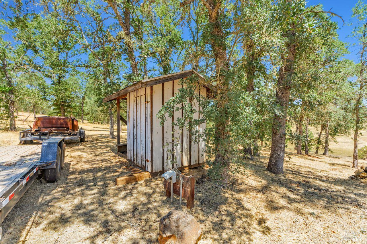 17277 Butts Canyon Road Middletown, CA 95461 - Photo 23 of 41 a view of a backyard with trees