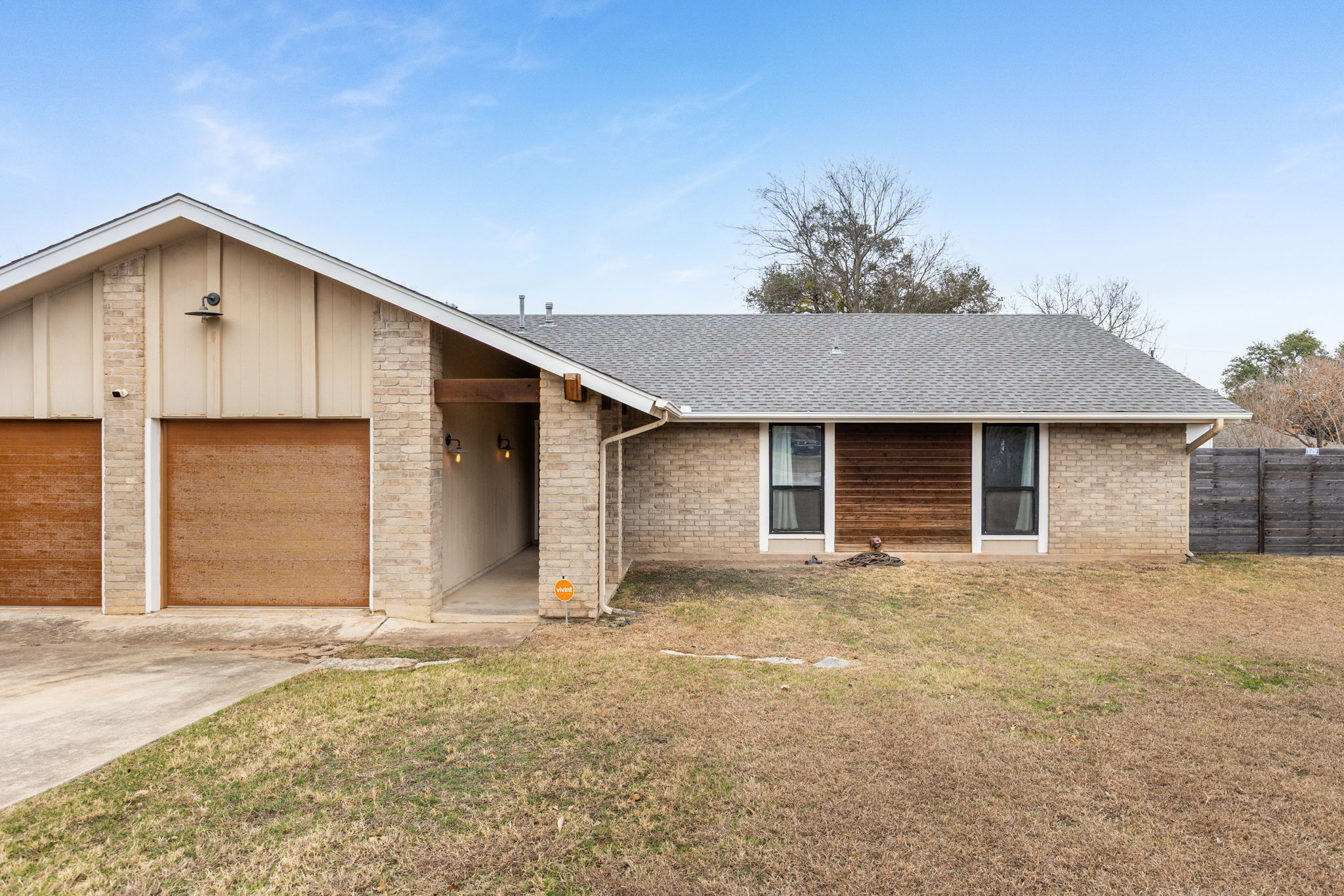 612 Meadowbrook Drive Georgetown, TX 78628 - Photo 4 of 35 View of front facade featuring an attached garage, concrete driveway, roof with shingles, and brick siding