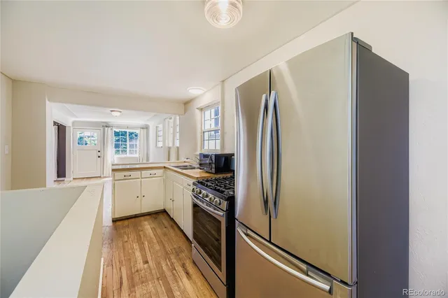a kitchen with a refrigerator a sink and dishwasher