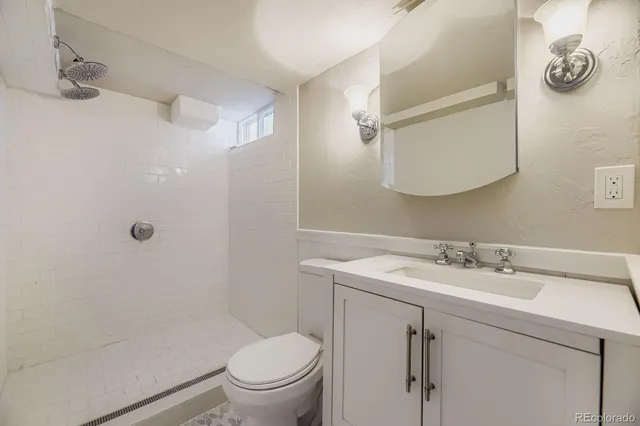 a bathroom with a sink toilet and vanity
