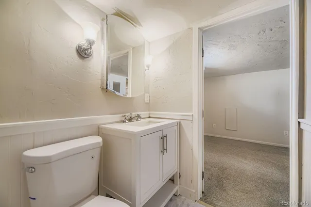 a view of bathroom with a sink and mirror