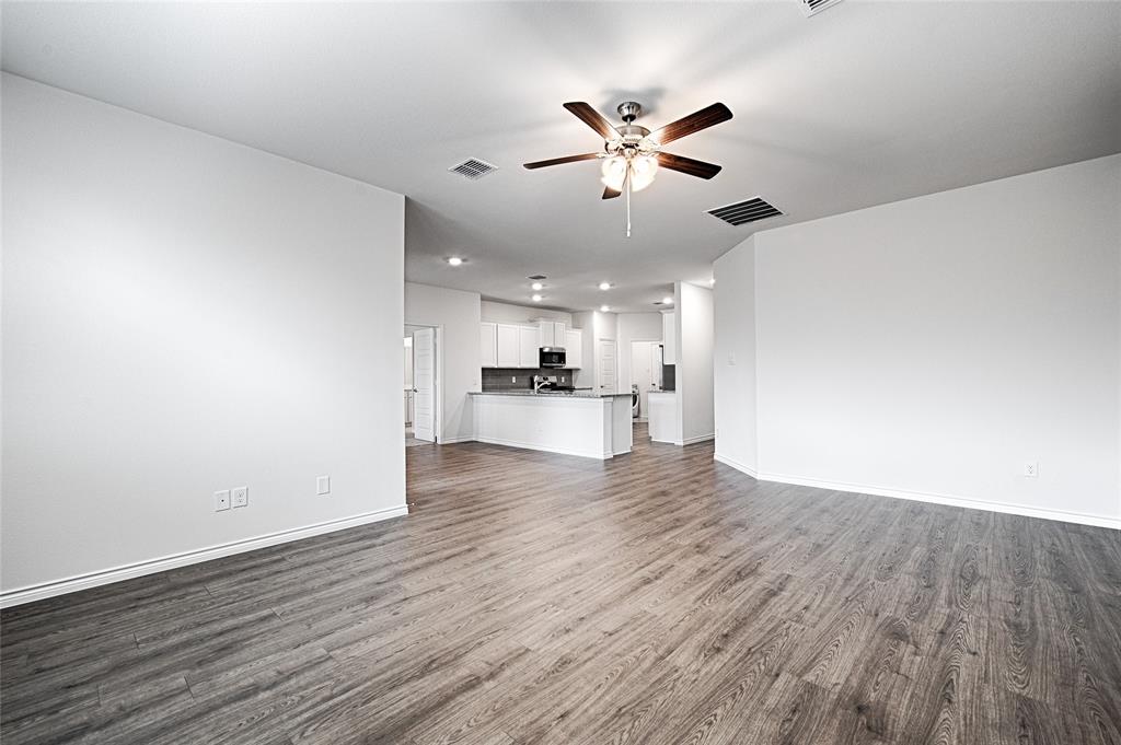 2427 Grapevine Way Celina, TX 75009 - Photo 21 of 38 a view of a kitchen with a sink and wooden floor