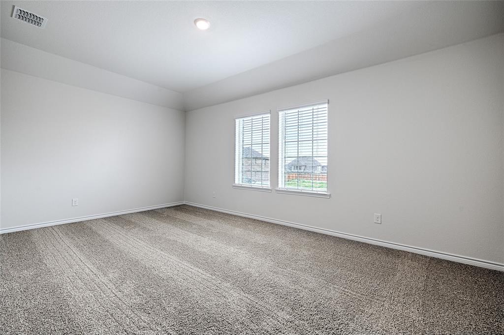 2427 Grapevine Way Celina, TX 75009 - Photo 29 of 38 an empty room with windows