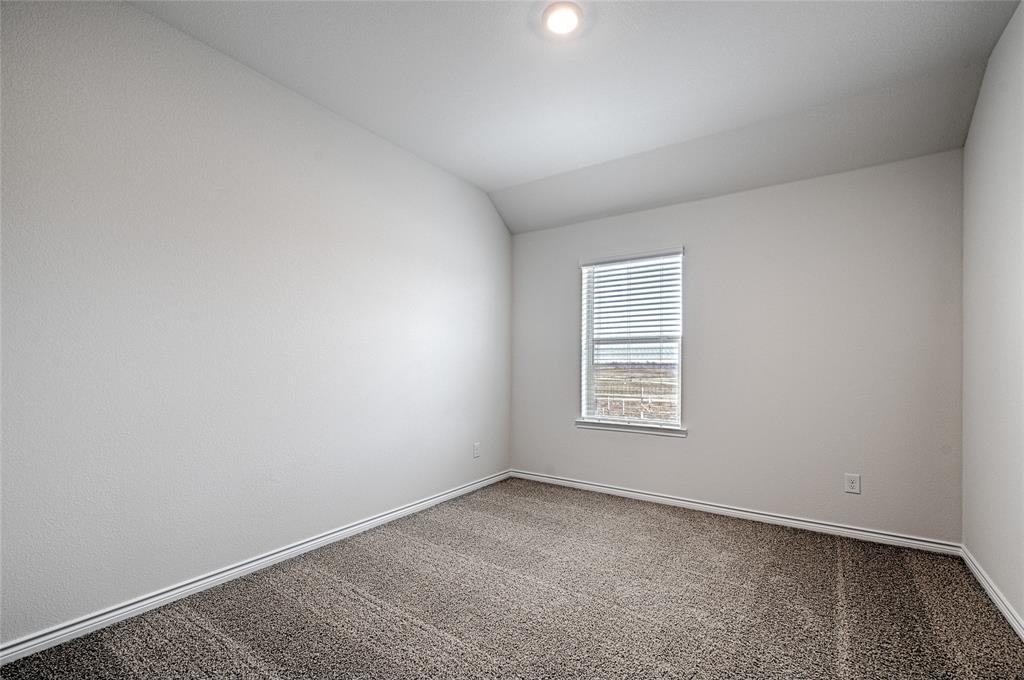 2427 Grapevine Way Celina, TX 75009 - Photo 31 of 38 an empty room with a window