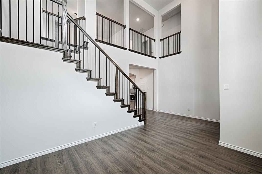 2427 Grapevine Way Celina, TX 75009 - Photo 6 of 38 a view of entryway with wooden floor