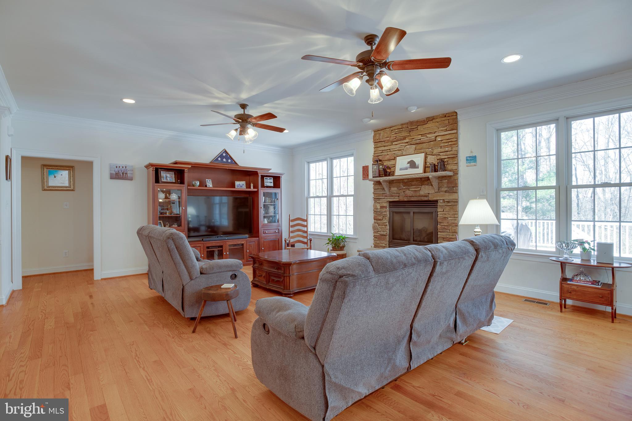 3279 Ridgeview Road Reva, VA 22735 - Photo 12 of 87 a living room with furniture a chandelier and a fireplace