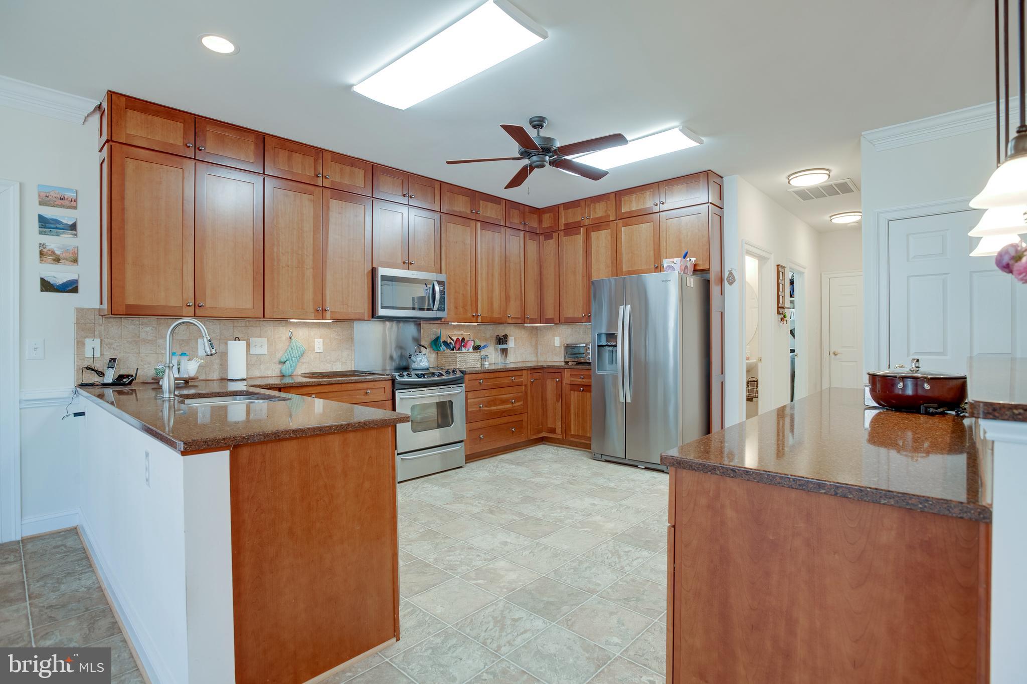 3279 Ridgeview Road Reva, VA 22735 - Photo 13 of 87 a kitchen with stainless steel appliances granite countertop a refrigerator a stove top oven a sink and dishwasher