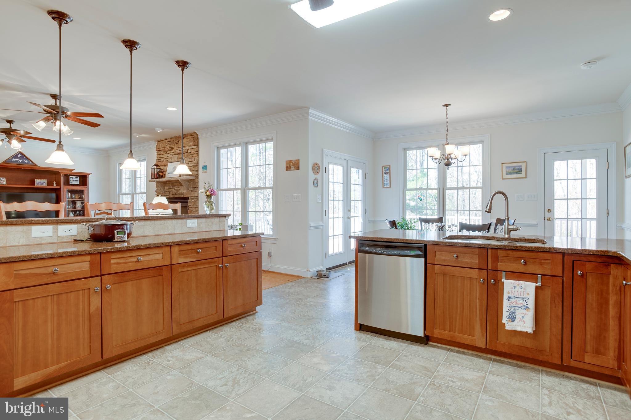 3279 Ridgeview Road Reva, VA 22735 - Photo 17 of 87 a large kitchen with stainless steel appliances granite countertop a stove a sink and a refrigerator