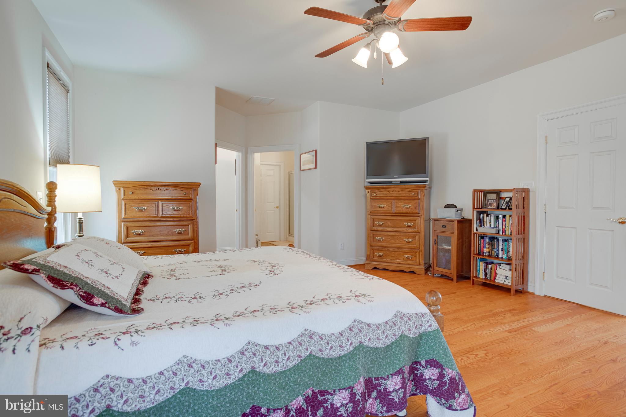 3279 Ridgeview Road Reva, VA 22735 - Photo 26 of 87 a bedroom with a bed and a chandelier