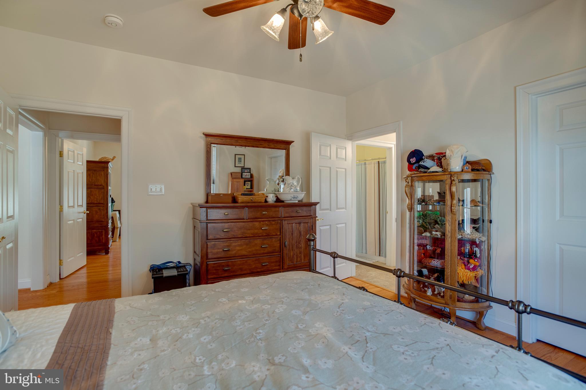 3279 Ridgeview Road Reva, VA 22735 - Photo 37 of 87 a bedroom with a bed and a chandelier