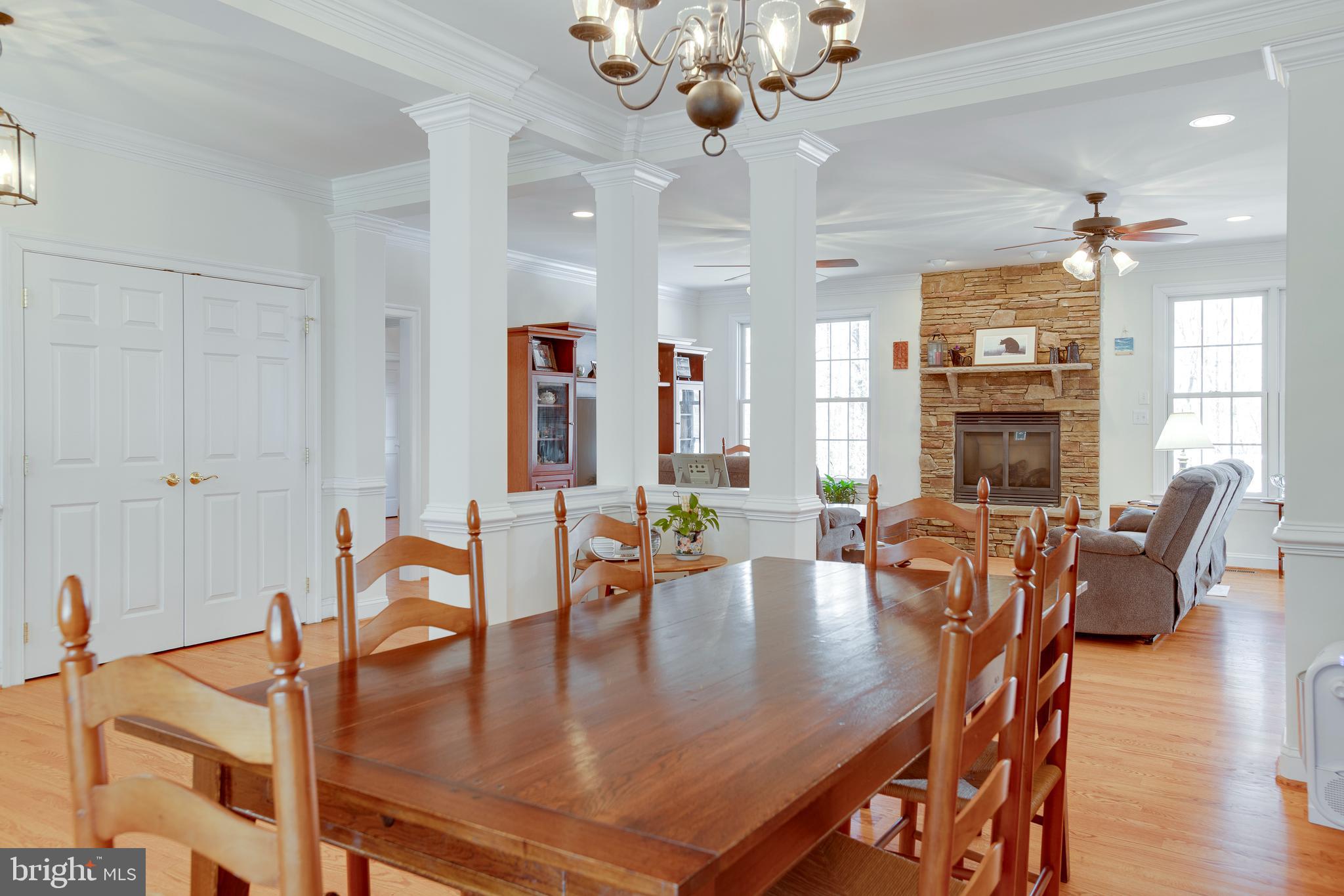 3279 Ridgeview Road Reva, VA 22735 - Photo 7 of 87 a view of a dining room and livingroom with furniture wooden floor a chandelier
