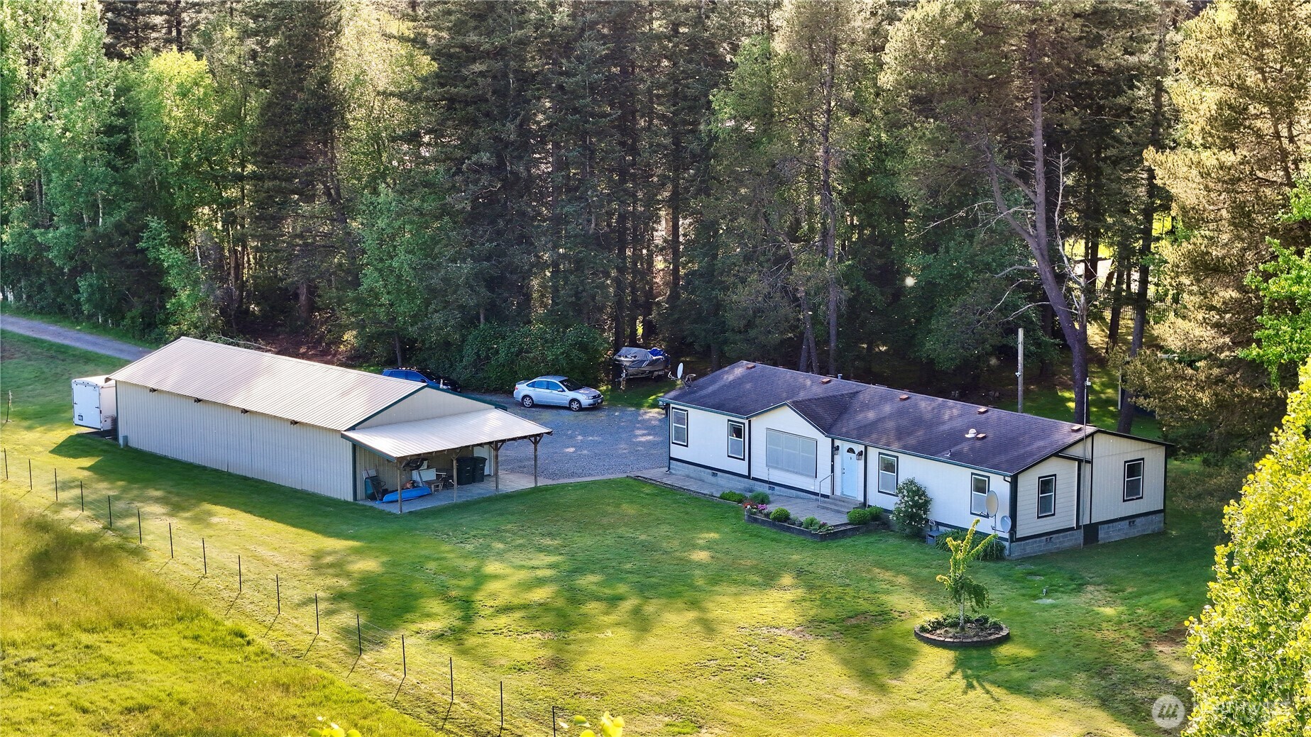 7928 Portal Way Custer, WA 98240 - Photo 2 of 39 a view of a house with a big yard and large trees