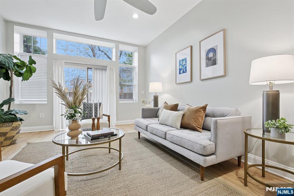 186 Walnut Street, Unit 114 Bloomfield, NJ 07003 - Photo 15 of 30 a living room with furniture and a large window
