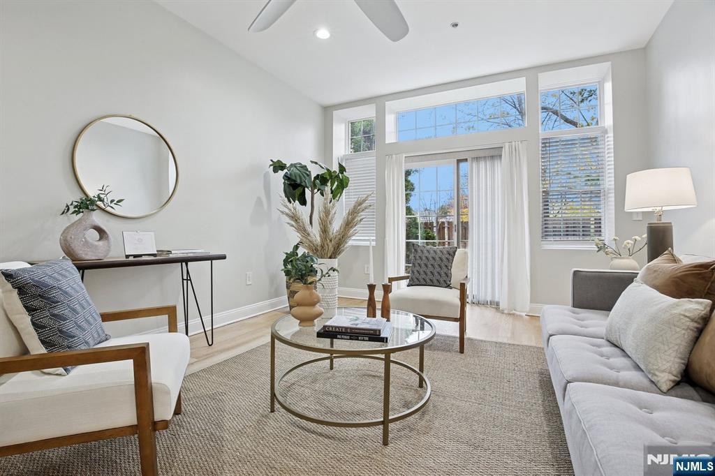 186 Walnut Street, Unit 114 Bloomfield, NJ 07003 - Photo 16 of 30 a living room with furniture a window and a potted plant