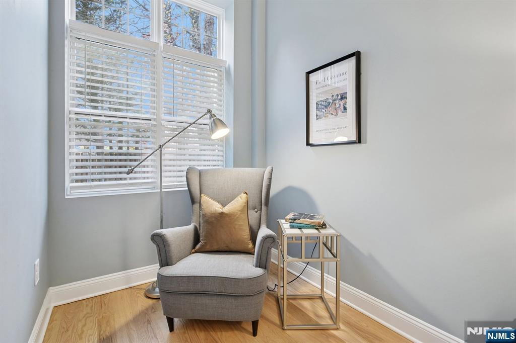 186 Walnut Street, Unit 114 Bloomfield, NJ 07003 - Photo 19 of 30 a living room with furniture and a window