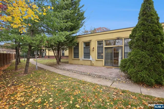 a house with trees in front of it