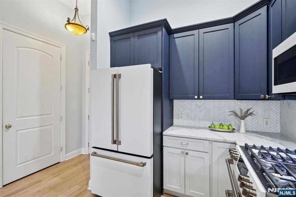 186 Walnut Street, Unit 114 Bloomfield, NJ 07003 - Photo 5 of 30 a utility room with dryer and washer