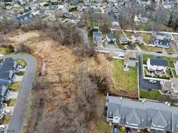 an aerial view of a house with a garden