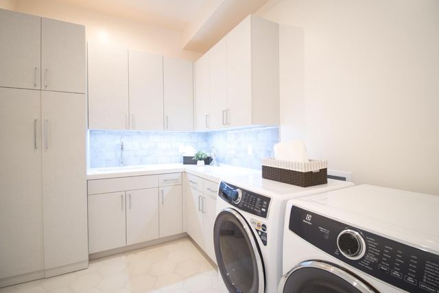 a bedroom with a bed and large window