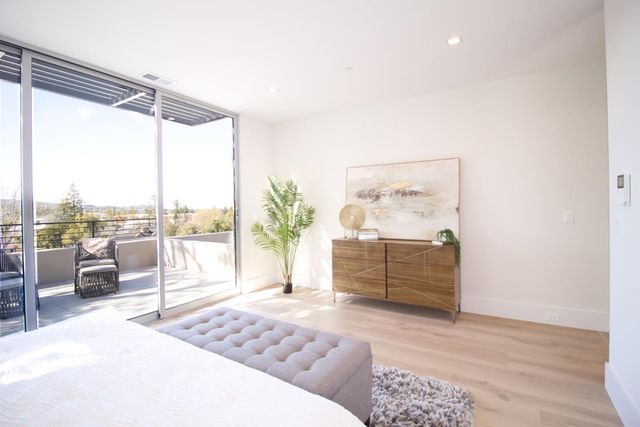 a bathroom with a granite countertop sink a toilet and bathtub