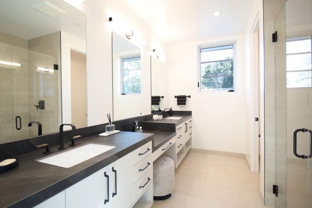 a bedroom with two beds and a window