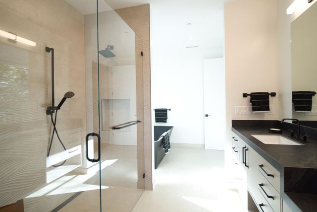 a front view of a house with a yard and a garage