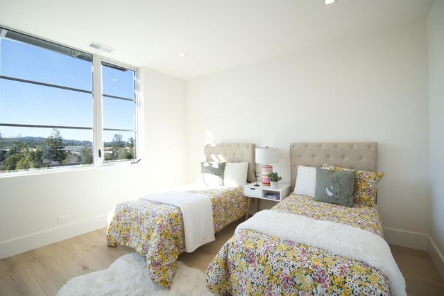 a kitchen with stainless steel appliances granite countertop a sink a stove and cabinets